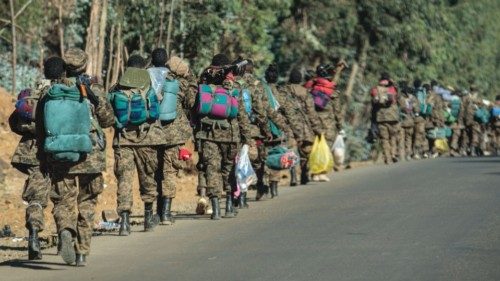 TOPSHOT - Soldiers of the Ethiopian National Defense Force (ENDF) walk along a road toward the ...