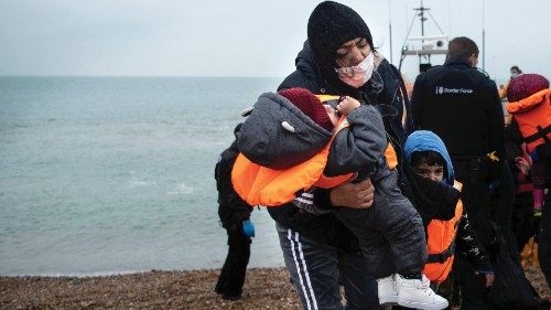 -- AFP PICTURES OF THE YEAR 2021 --
A migrant carries her children after being helped ashore from a ... -- AFP PICTURES OF THE YEAR 2021 --
A migrant carries her children after being helped ashore from a ...