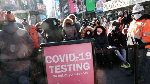 NEW YORK CITY - DECEMBER 20: People wait in long lines in Times Square to get tested for Covid-19 on ...