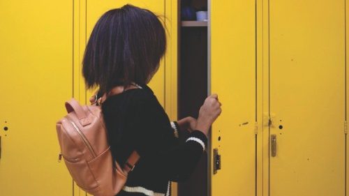 Jolli Phillips places her belongings in her locker before class begins at the Bates Academy on ...