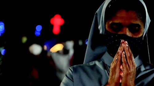 Christian devotees offer prayers at the Church of Our Lady of Light on the eve of Christmas in ...