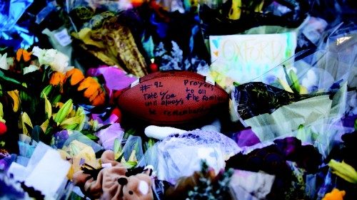 OXFORD, MI - DECEMBER 07: A football is seen placed at the memorial outside of Oxford High School on ...