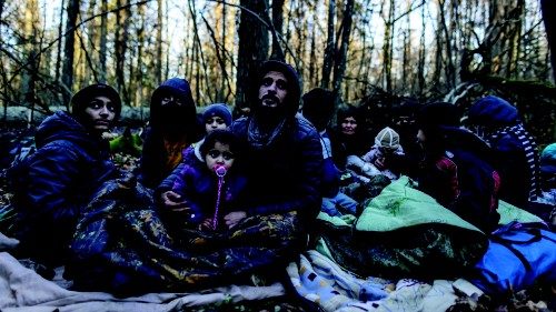 TOPSHOT - Members of a Kurdish family from Dohuk in Iraq are seen in a forest near the ...