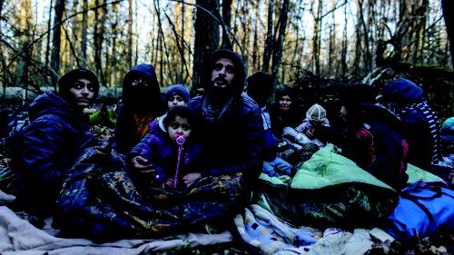 TOPSHOT - Members of a Kurdish family from Dohuk in Iraq are seen in a forest near the ... TOPSHOT - Members of a Kurdish family from Dohuk in Iraq are seen in a forest near the ...