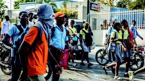 Students march through the Haitian capital Port-au-Prince on January 25, 2021 as they react to the ... Students march through the Haitian capital Port-au-Prince on January 25, 2021 as they react to the ...