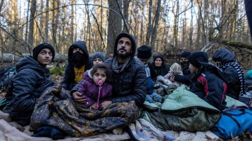 TOPSHOT - Members of a Kurdish family from Dohuk in Iraq are seen in a forest near the ... TOPSHOT - Members of a Kurdish family from Dohuk in Iraq are seen in a forest near the ...