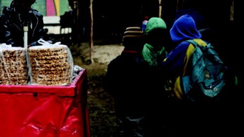 A vendor sells sweets at a cattle market in Kabul on December 30, 2021. (Photo by Mohd RASFAN / AFP) ...
