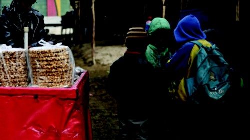 A vendor sells sweets at a cattle market in Kabul on December 30, 2021. (Photo by Mohd RASFAN / AFP) ... A vendor sells sweets at a cattle market in Kabul on December 30, 2021. (Photo by Mohd RASFAN / AFP) ...