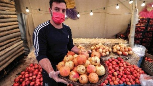 A man holds a basket of pomegranates during the Pomegranate Festival in Iran's capital Tehran on ... A man holds a basket of pomegranates during the Pomegranate Festival in Iran's capital Tehran on ...