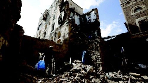 epa09666715 A Yemeni salvages belongings from his old building after it was partially collapsed in ...