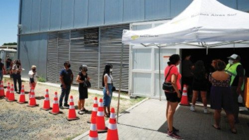 People wait in line to be tested for the coronavirus disease (COVID-19), in Buenos Aires, Argentina ...