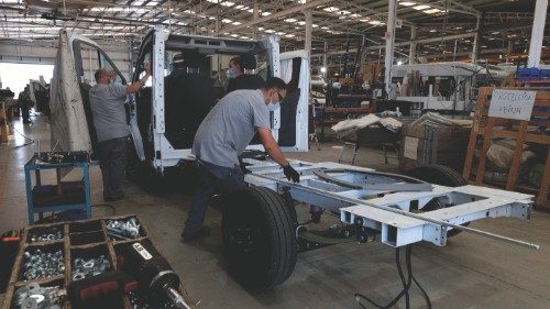 Employees work on the motorhome assembly line at the Benimar factory in Benicarlo near Castellon on ...