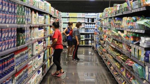 FILE PHOTO: Women check for prices inside a supermarket in Beirut, Lebanon, September 8, 2021. ...