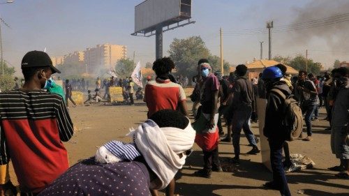 Protesters march during a rally against the military rule following last month's coup in Khartoum, ...