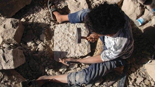 A child works at a stonecutting workshop in Yemen's third city of Taez, on November 20, 2021, ...
