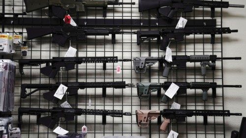 FILE PHOTO: AR-15 style rifles are displayed for sale at Firearms Unknown, a gun store in Oceanside, ...