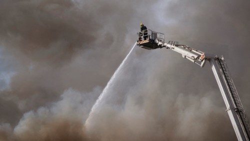 TOPSHOT - Firefighters are at work to extinguish a fire burning in the National Assembly, the main ... TOPSHOT - Firefighters are at work to extinguish a fire burning in the National Assembly, the main ...