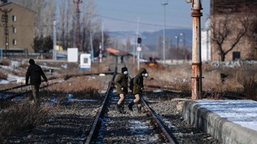 Boys walk on railtracks near Akyaka Train station on January 9, 2022 in Akyaka district of Kars ... Boys walk on railtracks near Akyaka Train station on January 9, 2022 in Akyaka district of Kars ...