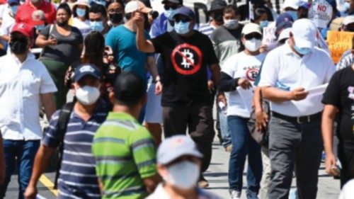 People take part in a demonstration against the circulation of Bitcoin and other economic measures, ...