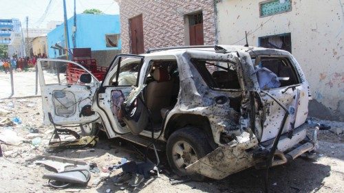 epa09689162 A destroyed car pictured in the aftermath of an explosion on a road in the capital ...