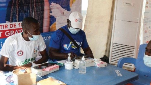 An Ivory Coast fan registers to receive the vaccine against the coronavirus disease (COVID-19) at a ...