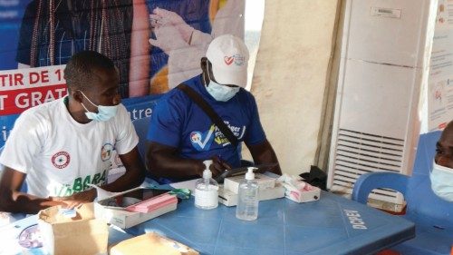 An Ivory Coast fan registers to receive the vaccine against the coronavirus disease (COVID-19) at a ... An Ivory Coast fan registers to receive the vaccine against the coronavirus disease (COVID-19) at a ...