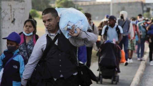 FILE PHOTO: Migrants from Central America walk in a caravan as they set off for the United States, ...