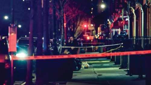 A general view shows the taped off area marking the scene of a shooting in Harlem, New York on ...