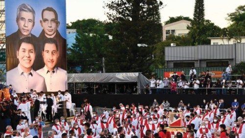 A giant photo is revealed during the beatification ceremony of 4 martyrs of the Catholic Church, the ...