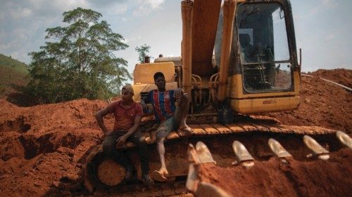 Illegal gold miners rest on a broken machinery at an illegal gold mine in Sao Felix do Xingu, Para ...