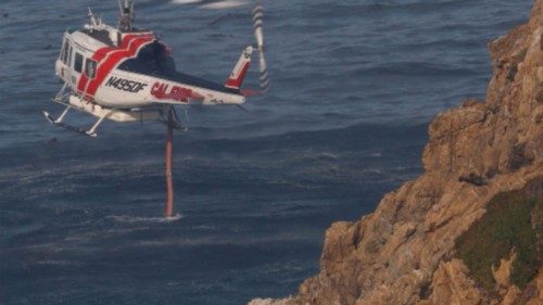 A Cal Fire water dropping helicopter draws water from the Pacific Ocean as the Colorado Fire burns ... A Cal Fire water dropping helicopter draws water from the Pacific Ocean as the Colorado Fire burns ...