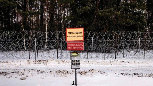 TOPSHOT - A sign reads 'State Border - do not cross' at the barbed wire fence along the ...