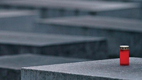 epa09712090 A single candle rests on on of the stele of the Memorial to the Murdered Jews of Europe, ... epa09712090 A single candle rests on on of the stele of the Memorial to the Murdered Jews of Europe, ...