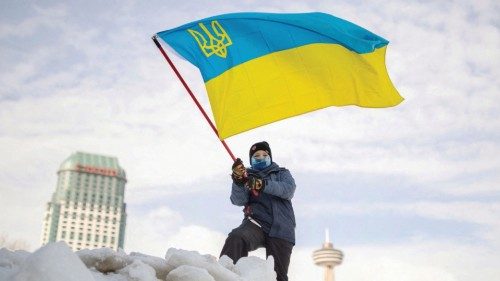 A boy waves a Ukrainian flag during a rally in support of Ukraine and against Russia, in Niagara ...