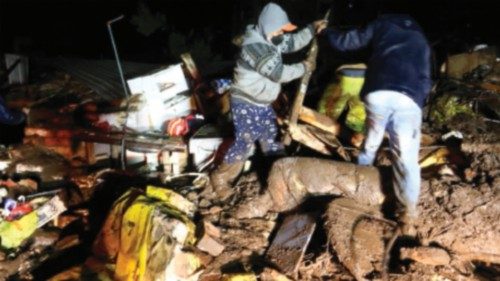 Picture released by Ecuadorean agency API showing people removing debris during the search of ...