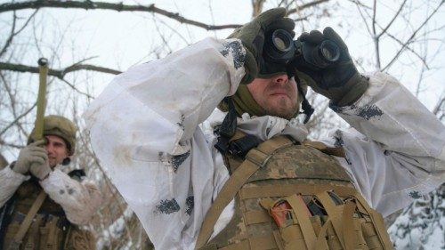 Service members of the Ukrainian armed forces are seen at combat positions near the line of ...