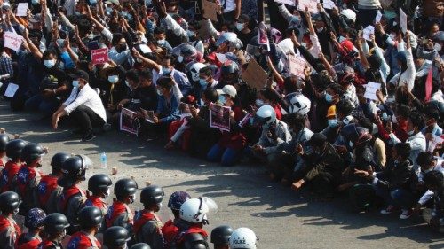 epa09711488 (12/31) (FILE) - Riot police stand guard as demonstrators flash the three-finger salute, ... epa09711488 (12/31) (FILE) - Riot police stand guard as demonstrators flash the three-finger salute, ...