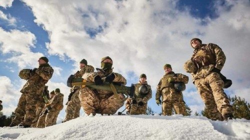 Ukrainian service members take part in drills at a training ground in the Lviv region, Ukraine, in ...