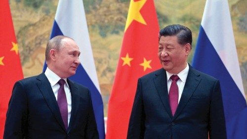 TOPSHOT - Russian President Vladimir Putin (L) and Chinese President Xi Jinping pose for a ... TOPSHOT - Russian President Vladimir Putin (L) and Chinese President Xi Jinping pose for a ...