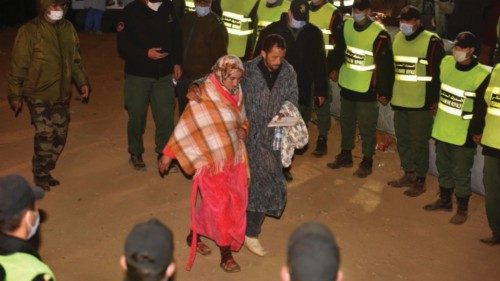 epaselect epa09730962 The parents of 5-year-old Rayan are seen after rescue workers carried his body ... epaselect epa09730962 The parents of 5-year-old Rayan are seen after rescue workers carried his body ...