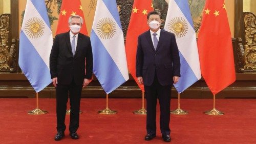 Chinese President Xi Jinping stands next to Argentina's President Alberto Fernandez during their ...