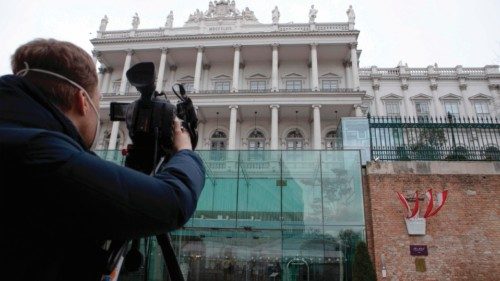 A cameraman films the Hotel Palais Coburg, venue of the meeting of the Joint Comprehensive Plan of ...