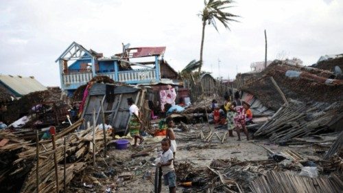Locals stand among destroyed houses, in the aftermath of Cyclone Batsirai, in Mananjary, Madagascar, ... Locals stand among destroyed houses, in the aftermath of Cyclone Batsirai, in Mananjary, Madagascar, ...