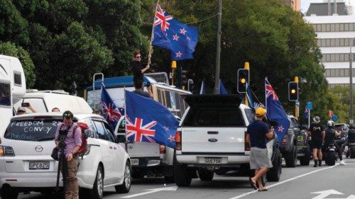 Protesters wave flags from vehicles parked on the streets outside the parliament building in ... Protesters wave flags from vehicles parked on the streets outside the parliament building in ...
