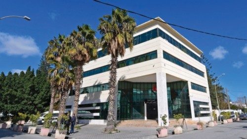 Members of the Tunisian security forces stand outside the closed headquarters of Tunisia's Supreme ...