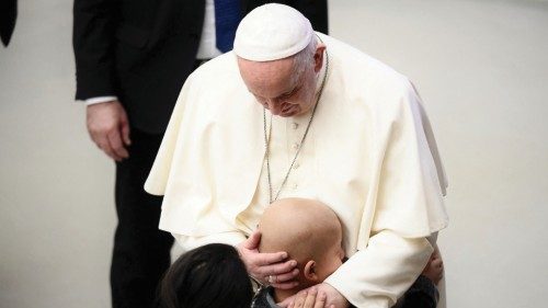 Pope Francis hugs a sick child after the general audience in the Paul VI Hall at the Vatican on ... Pope Francis hugs a sick child after the general audience in the Paul VI Hall at the Vatican on ...