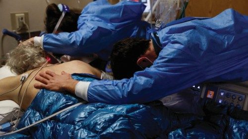 FILE PHOTO: A son and daughter embrace their father, a coronavirus disease (COVID-19) patient in the ... FILE PHOTO: A son and daughter embrace their father, a coronavirus disease (COVID-19) patient in the ...