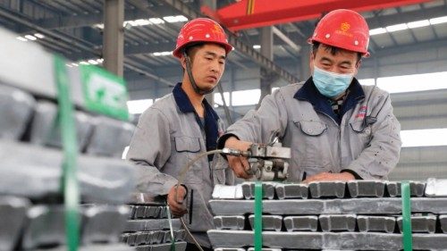 Employees work with aluminium ingots at a factory in Huaibei in China's eastern Anhui province on ...