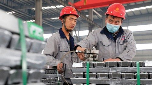 Employees work with aluminium ingots at a factory in Huaibei in China's eastern Anhui province on ... Employees work with aluminium ingots at a factory in Huaibei in China's eastern Anhui province on ...