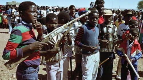 Children role play with dummu guns as thousands of South West Africa People's Organisation (SWAPO) ...